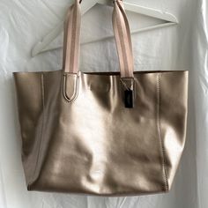 14 Inches In Width, 12 Inches In Height (From The Bottom Of The Bag To The Top), And Has A Handle Drop Of 9.5 Inches Bags Coach, Pink Gold, Womens Tote Bags, Coach Bags, Pink And Gold, Derby, Gold Metal, Rose Gold, Tote Bag