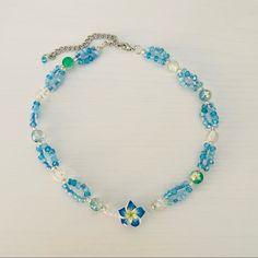 Blue Hawaii Tropical Beaded Necklace Handmade By Me And One Of A Kind! It Has Clear Beads And Loops Of Aqua Blue Tiny Beads. In The Middle Is A Beautiful Hibiscus Flower It’s A Short Necklace But The Length Can Be Adjusted To Wear It As A Choker As Well. Measures 14”-16” #Y2k #Coconutgirl #Surf #Tropical #Aesthetic Summer Blue Necklaces With Spacer Beads, Blue Beaded Necklaces For Jewelry Making In Summer, Blue Beaded Necklace With Spacer Beads For Summer, Blue Beaded Necklaces With Spacer Beads For Summer, Summer Blue Necklaces With Faceted Beads, Light Blue Beaded Necklaces With Round Beads For Summer, Light Blue Beaded Flower Jewelry, Light Blue Flower-shaped Beaded Jewelry, Summer Blue Beaded Necklaces With Faceted Beads