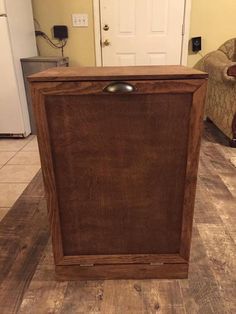 a wooden cabinet sitting on top of a hard wood floor