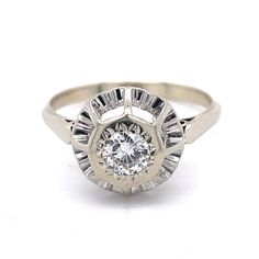 an antique style diamond ring on a white background