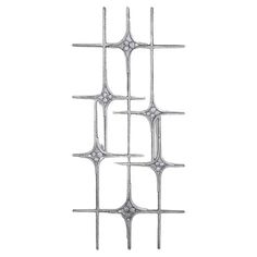 a metal structure with four intersecting sections on each side and one in the middle, against a white background