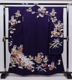 This striking silk Furisode Kimono is covered in floral.  A vintage Japanese long sleeved dress with extra long length for trailing on the ground when you walk. Wear this Kimono dress for your special event, or hang  it as a display to enjoy everyday. Item: Furisode Silk Kimono No. frn193 Size: US  M-L   /  Length 62.5 inches (159cm), Width 25.5 inch (65cm). Condition: Used, Vintage, Good. Please check the photos. Need a KIMONO RACK to hang this kimono?  Find it here: https://www.etsy.com/listin Floral Print Long Sleeve Kimono For Wedding, Long Sleeve Floral Print Kimono For Wedding, Long Sleeve Floral Kimono For Wedding, Long Sleeve Floral Print Wedding Kimono, Blue Silk Kimono For Wedding, Long Floral Embroidered Kimono For Wedding, Blue Silk Wedding Kimono, Vintage Silk Kimono For Wedding, Traditional Wedding Kimono With Floral Embroidery