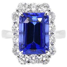 A beautiful ring featuring a 5.58 Carat Natural Tanzanite and 1.39 Carats Diamond Accents set in Platinum. Tanzanite's name was given by Tiffany and Co after its only known source: Tanzania. Tanzanite displays beautiful pleochroic colors meaning they display different colors depending on the gems's viewing direction. The ring is made in Japan. Ring size and stamping detailed below. Contact Us for more information. Ring Size: 11 (Japan), 6 (US), L 1/2 (UK/Australia) Stamping: Pt900 5.58 D1.39 ---------------------------------------------------------------------------------------------- Established in 1994, Rita Fine Jewelry has been making beautiful jewelry for the past 25 years plus. We specialize in Colored Stone Jewelry and offer a wide range of products including rings, pendants, bracel Golden Rings, Diamond Cocktail Ring, Tanzanite Diamond, Paraiba Tourmaline, Golden Ring, Colored Stone, Diamond Cocktail Rings, Natural Tanzanite, Tiffany And Co