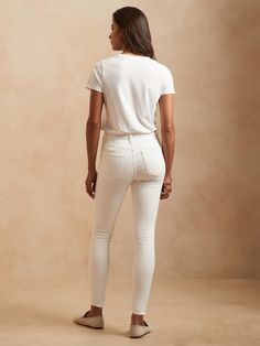 SKINNY FIT: A high-rise skinny jean with perfectly placed back pockets and a curved waistband to fit and flatter.  ITALIAN DENIM: Our sheer-proof white jeans with beige pockets (so they won't show through), this denim from Italy's Candiani mill is lo Curved Waistband, Denim Shoes, Winter Sale, Petite Size, Blouse Dress, Denim Women, Stretching, White Jeans, New Product