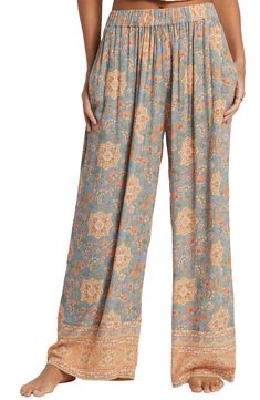 Feel the breeze in these flowy crinkle-textured pants covered in a lively print with contrasting borders. 28" inseam Elastic waist Side-seam pockets 100% viscose Machine wash, tumble dry Imported Floral Print Patterned Bottoms For Vacation, Patterned Floral Print Bottoms For Vacation, Bohemian Blue Printed Bottoms, Bohemian Style Printed Blue Bottoms, Spring Printed Rayon Bottoms, Printed Rayon Wide-leg Pants, Vacation Printed Rayon Pants, Vacation Rayon Printed Pants, Casual Boho Print Bottoms For Beach