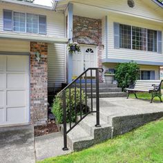 a house with stairs leading up to the front door