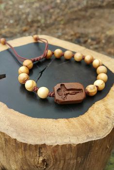 +. God Bless You. +. This is a Wooden Rosary Bracelet. +. It is knotted bracelet and it is adjustable . +. The crufix is carved in elevorate and three dementional shape. +. Beads are not round but beautifully angled. +.+.+.+.+. Materials +.+.+.+.+.+. Cross: Surinam Ebony Beads :olive tree +.+.+.+.+. Size +.+.+.+.+. Cross : 13.3mm(Width) *20mm(Height) Beads: 8mm +. Engraved characters(e.g. baptismal name, name,etc) on back side. It's Free engraving +. please send me characters that you want. +.Wo Spiritual Brown Rosary Bracelet For Gift, Handmade Brown Rosary Bracelet As Gift, Catholic Rosary Bracelet, Knotted Rosary, Mens Rosary, Wooden Rosary, Knotted Bracelet, Catholic Cross, Light Brown Color