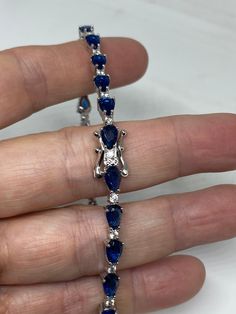 Vintage Cubic Zirconia Bracelet Clear blue Crystal Tennis 7.5 inches All jewelry is shipped free in the US in a nice gift box. Check out our over a THOUSAND great reviews Engraving is $4 per letter and is not always perfect depending on the piece. It can take a few days if the jeweler is busy. This is payable to Paypal Judithsltd@gmail.com Blue Sapphire Round Bracelet, Blue Jubilee Tennis Bracelet For Anniversary, Blue Tennis Bracelet With 17 Jewels For Anniversary, Blue Anniversary Tennis Bracelet With 17 Jewels, Fine Jewelry Sapphire Bracelets With Cubic Zirconia, Sapphire Cubic Zirconia Bracelets Fine Jewelry, Sapphire Cubic Zirconia Fine Jewelry Bracelets, Sapphire Cubic Zirconia Tennis Bracelet With Gemstone, Blue Sapphire Tennis Bracelet With Gemstone