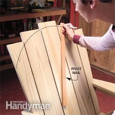 a man is working on a wooden chair with the legs and back section cut out