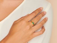 A gorgeous design, this cocktail ring is boldly unexpected. Stunning in its simplicity, the ring features an inlay pear-shaped emerald beautifully set in a gold band that packs a punch. Emerald stone size: 3mm x 5mm; Band is made of 14k gold over sterling silver. Adjustable band between size 7-9 Hypoallergenic, nickel and lead free Tarnish resistant Caro Emerald, Dome Ring, Emerald Stone, Domed Ring, Stone Design, Gold Filled Jewelry, Gorgeous Design, Gold Band, Cocktail Ring