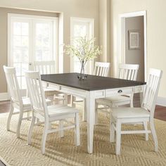 a white table and chairs in a room