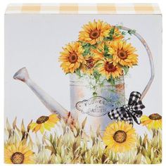 Dimensions: 3.88" H x 3.88" W x 1.19" D Material: MDF Shape: Square Color: White, Yellow, Green & Gray Pattern: Check Orientation: Vertical Quantity: 1 Add a touch of country charm to your fall home this year! Garden Sunflowers Wood Decor boasts an image of bright sunflowers in a vintage watering can. Along the piece's sides is a white and yellow checkered pattern, completing its country look. Place it on the table, counter, or mantel of your farmhouse home for an added element of rural fall dec Garden Sunflowers, Sunflowers And Bees, Thanksgiving Tabletop Decor, Vintage Watering Can, Fall Dec, Yellow Checkered, Table Counter, Sunflower Decor, Happy Flowers