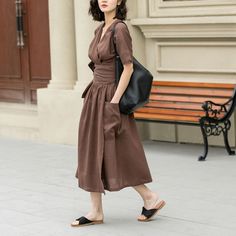 This elegant linen dress exudes a timeless charm with its deep brown hue and minimalist design. The dress falls to a mid-calf length, offering a flowy and comfortable fit that moves with ease. Ideal for both casual outings and more formal events.  DETAIL * 100% Linen * Two side big pockets * V neck dress * Short sleeve linen dress * Plus size dress * Fabric belted Linen dress * Midi length * Perfect for summer, spring * Casual linen dress, plus size linen dress * Wash by hand or machine with col Brown V-neck Solid Color Dress, Brown V-neck Solid Dress, Brown V-neck Dress, Casual Brown Linen Maxi Dress, Chic Brown Linen Dress For Spring, Solid Linen V-neck Maxi Dress, Brown Linen Spring Dress, Linen V-neck Midi Dress, Casual Brown Linen Midi Dress