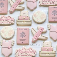 pink and white cookies decorated with travel related items