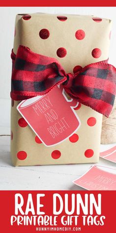 a gift wrapped in brown paper with red and black polka dots on it, next to a