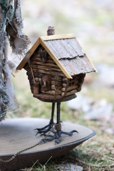 a small bird house made out of wood