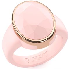 a pink ring with an inscription on the side and a rose quartz stone in the center