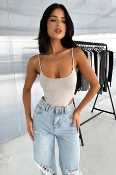 Say hello to the Hallie Bodysuit! She offers a high cut brief, round neckline, adjustable straps, double lining and a button up closure underneath. Match her with basic denim jeans and sneakers FABRICATION: 95% Polyester / 5% Elastane SIZING: Crystal's height is 160cm/5'2 and wears a size AU 6 / US 2. Jeans Bodysuit Outfit, Jeans Bodysuit, Jeans And Bodysuit, Bodysuit Outfit, So Fetch, Body Suit Outfits, High Cut, Say Hello, Round Neckline