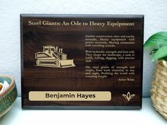 there is a plaque on the shelf that says steel giants are old to heavy equipment