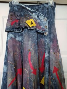 VTG ATTENTE Hand Painted Denim Rayon Blend Maxi Skirt Long with Button Panel at the front Blue. Size 8.  Stunning Boutique design. Hand Painted Embellished Abstract Retro Designer Look skirt with flared bottom.  Rayon cotton blend.  Matching jacket is available listed separately.  Hand Painted Embellished 65% Rayon / 35% Cotton Panel at the front Zipper at the back. flared look skirt (please see photos) Measurements: Length - Approximately 35" measured from the lower seam of the 2" waistband to the hem edge Waist - Approximately 13" seam to opposite side seam Hip area - Approximately 17" side to opposite side measured laying flat Widens to skirt bottom All measurements and colors are approximate and as close as possible.  Please examine the photos for additional details and conditions whic Blue Denim Skirt With Button Zip Fly, Fitted Blue Skirt With Button Zip Fly, Fitted Blue Skirt, Fitted Denim Blue Denim Skirt With Buttons, Fitted Denim Blue Skirt With Button Closure, Fitted Dark Wash Skirt With Snap Buttons, Blue Skirt With Snap Buttons For Summer, Fitted Cotton Denim Skirt With Snap Buttons, Fitted Medium Wash Skirt With Buttons