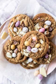 easter brown sugar cookies with mini eggs on a white plate and text overlay that reads, easter brown sugar cookies with mini eggs