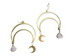 These crescent moon earrings are a sparkly statement! Made using brass, 14k gold filled wire, and your choice of stone. They measure 1.5” wide. *Pieces are handmade to order - please allow up to 1 week before shipping. Thank you for supporting small business! Gold Moon-shaped Wire Wrapped Jewelry, Handmade Brass Half Moon Jewelry, Gold Crescent Wire Wrapped Jewelry, Adjustable Crescent Brass Jewelry, Handmade Crescent Brass Jewelry, Wire Wrapped Moon Shaped Earrings, Gold Crescent Moonstone Earrings, Wire Wrapped Crescent Metal Jewelry, Mystical Crescent Brass Earrings