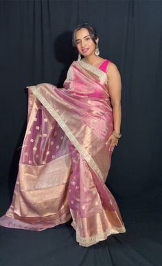 The Opulent Tissue Silk Saree with Gotta Patti Drape yourself in timeless elegance with The Chic Tale's Opulent   Tissue Silk Saree. This exquisite piece showcases the beauty of craftsmanship, featuring a base of shimmering tissue silk adorned with intricate gold zari motifs and then embellished with gotta Patti. Enchanting Design: Delicate tissue silk drapes effortlessly, offering a luxurious feel and a graceful fall. The captivating design woven with shimmering gold  threads, adds a touch of r Tussar Silk Saree With Gota Work For Celebrations, Celebration Tussar Silk Saree With Gota Work, Elegant Pink Pre-draped Saree In Tussar Silk, Elegant Pink Pre-draped Saree With Zari Weaving, Elegant Silk Saree With Gota Work, Elegant Katan Silk Saree With Gota Work, Festive Fusion Blouse Piece For Diwali, Elegant Art Silk Blouse Piece With Gota Work, Transitional Saree With Gota Work