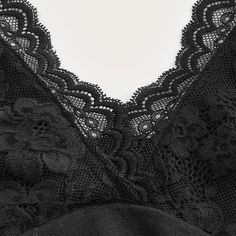 Immerse yourself in the dark allure of our Gothic Lace Halter Crop Top. This sultry top features a deep v-neck and an enticing open back, ideal for evenings out or cozy nights in. Crafted from a premium blend of polyester and spandex, the floral lace detailing adds a sophisticated flair to the chic black design. Elevate your ensemble with this exclusive crop top that exudes style and elegance. Deep v-neck Open back Halterneck design Crafted from polyester and spandex blend Black color Intricate Party V-neck Top Bra Friendly, V-neck Bra Friendly Top For Night Out, Chic V-neck Camisole Bra Friendly, Low-cut Camisole With Built-in Bra For Night Out, Party V-neck Camisole With Built-in Bra, Elegant Low-cut Top With Built-in Bra, V-neck Camisole For Night, Seamless V-neck Party Tops, V-neck Bra Friendly Camisole For Night Out