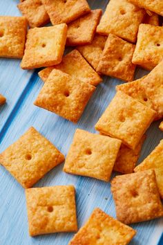 a pile of crackers sitting on top of a blue table