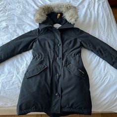 Canada Goose Rossclair Parka - Size: Small - Color: Black - Condition: Perfect. Only Sign Of Wear Is Minor Marks By Front Pockets (See Photos) - Features: 2 Front Pockets, 2 Interior Pockets One With Zipper And One Mesh Pocket, Adjustable Waist Via Interior Drawcord, Interior Backpack Straps To Carry Jacket, Zipper In Back For Ventilation, Removable Fur Hoodie - Parka Has Been Worn Less Than 20 Times And Been Dry Cleaned Since Last Wear. It Is In Perfect Condition. I’m Selling Because I Haven’t Used It In 2 Years And No Longer Have The Need For It. Canada Goose Rossclair Parka, Fur Hoodie, Jacket Zipper, Backpack Straps, Canada Goose, Canada Goose Jackets, Parka, Carry On, Jackets For Women