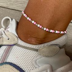 🌸 baby pink, white and silver miracle bead anklet 🌸  ♥️Catches the light to give off a glow!  ♥️Perfect for nights out or even holidays!  ♥️Please message me if you have any questions each  ♥️ All anklets are made on rope. The two ends will need to be tied together and in a double knot so that the anklet does not come off. These are safe to wear in water.  Also available with matching bracelets, earrings and chokers! The colour may vary slightly due to most images being taken under direct sunlight or with flash to show you the full effect of the beads x  White beads may appear grey/silver when opened in a dark room. The full effect of the beads will shine through in different lights. Please note: Buyer pays for any return postage/ exchange postage x Cheap Pink Anklets For Festivals, Bead Anklet, Double Knot, Beaded Anklets, Anklet Jewelry, Matching Bracelets, Baby Star, White Beads, Chain Styles