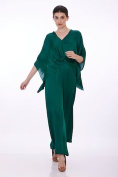 Emerald green draped kaftan with plunge V neckline. - Aza Fashions Chic Silk V-neck Kaftan, Elegant Draped Kaftan With Draped Sleeves, Elegant Green Spring Kaftan, Silk V-neck Evening Kaftan, Elegant Green Kaftan For Party, Spring Evening V-neck Kaftan, Elegant Green Kaftan For Evening, Draped Kaftan, Kaftan Sleeves