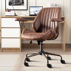 a brown office chair sitting in front of a desk