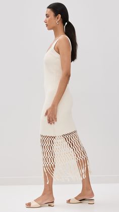 Find AMUR Archie Fringe Crochet Midi Dress on Editorialist. Fabric: Heavyweight stretch knit. Tiered crochet at hem. Round neckline. Sleeveless. Pullover design, no closure. Shell: 100% cotton. Lined. Dry clean. Imported, China. Measurements: Measurements from size S Length: 52.75in / 134.0cm, from shoulder White Knitted Dress For Spring, Chic White Crochet Dress With Pointelle Knit, White Crochet Dress With Pointelle Knit, White Pointelle Knit Crochet Dress, Chic White Crochet Knit Dress, Elegant Crochet Top For Summer, Chic Summer Crochet Dress With Pointelle Knit, Chic Crochet Dress With Pointelle Knit For Summer, Knee-length Crochet Knit Dress For Spring