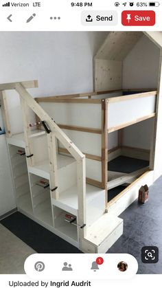 a bunk bed built into the side of a wall next to a black and white floor