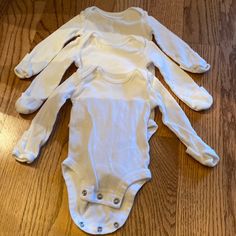 3 Piece White Long Sleeve Bodysuit: Newborn, New Never Worn Without Tags, Reversible Mitted Sleeves White Fitted Long Sleeve Bodysuit, White Long Sleeve Bodysuit For Sleep, White Stretch One-piece Bodysuit, White Bodysuit Longsleeve, White Long Sleeve Bodysuit, White Long Sleeve Playwear For Babies, Gingham Jacket, Asics Running Shoes, Nike Acg Jacket