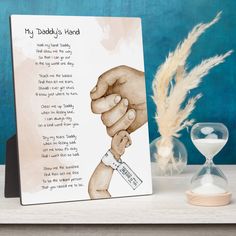 a card with an image of two hands holding each other and the words my daddy's hand on it