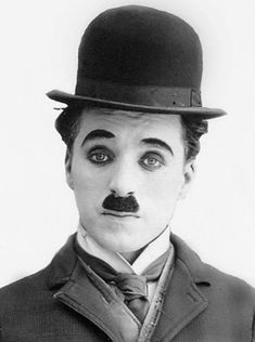 an old photo of a man wearing a top hat and moustache with a mustache