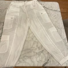 Brand New With Tags Athleta White Cargo Parachute Oants. Size 16. White Sweatpants With Elastic Waistband For Sports, White Sporty Parachute Pants For Loungewear, Sporty White Parachute Pants For Loungewear, White Sports Joggers With Elastic Waistband, White Athleisure Joggers With Elastic Waistband, White Relaxed Fit Activewear For Jogging, White Joggers With Elastic Waistband For Jogging, Sporty White Joggers With Elastic Waistband, White Jogging Pants With Elastic Waistband