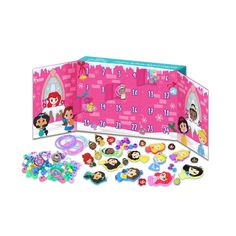 a pink box filled with lots of stickers and magnets on top of it