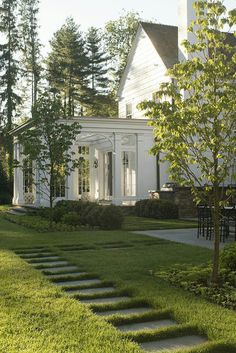 a white house with steps leading up to it