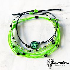 YOU CAN NOW SHOP ON MY NEW WEBSITE! www.summerstylebracelets.com This I Come in Peace Alien wax cord bracelet pack is the perfect gift for the out of this world, alien lover in your life! The beaded bracelet also glows in the dark! Completely waterproof, adjustable so it will fit any size wrist. Just pull to close. All of my friendship bracelets are made with 100% cotton embroidery floss & my water proof jewelry is made with 100% waxed polyester cord. Any other supplies I use are all natural & eco friendly & everything is made in a smoke-free & pet-free home! Green Beaded Bracelets For Summer Gifts, Summer Friendship Bracelets With Green Round Beads, Green Round Beads Friendship Bracelets For Summer, Adjustable Green Friendship Bracelets For Summer, Green Beaded Bracelets For Summer Festivals, Green Friendship Bracelets For Summer Gift, Green Summer Friendship Bracelets As Gift, Green Braided Bracelets As Summer Gifts, Green Braided Bracelets For Summer Beach