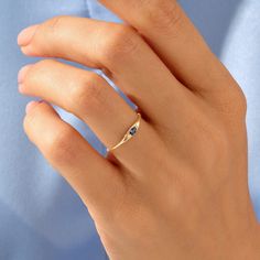 Elevate your style with our Basic Marquise Sapphire Ring, a minimalist and elegant piece designed for women who appreciate the timeless beauty of marquise-cut sapphires and the significance of a birthstone ring. Ring Details ❥  14k Solid Gold (also in 18K) ❥  Gold Colour Options: Yellow Gold, White Gold, Rose Gold ❥  Band Width: 0.85 mm ❥  Top Width: 2.05x5.20 mm ❥  Thickness: 0.80 mm ❥  Gemstone: AAA Grade White Cubic Zirconia ❥  Ready to Ship 4-7 Business Days MORE FROM US Statement Rings: https://etsy.me/3bb0QYW More about my shop: https://etsy.me/3mwMnsA ESSENTIAL INFORMATION 💎 BRENNMORE pieces are handcrafted by 15-30 years of experienced craftsmen and made to order. 🎁 All pieces come in a special turquoise gift box wrapped beautifully with a ribbon 🌎 All of our materials are ethic Sapphire Birthstone Ring, Marquise Sapphire, Blue Gemstone Ring, Dainty Rings, September Birthstone Rings, Blue Gemstone Rings, Cute Engagement Rings, Gold Color Ring, Ring Marquise