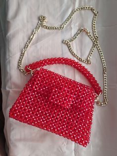 This luxurious beaded evening bag is handmade Bag made of round beads red color. The versatile color will complement any outfit. Bead size 8*6 mm,  Beads are faceted, meaning they are cut with many small flat surfaces that reflect and refract light to create a sparkling, shimmering effect In the work, a fishing line 0.6 mm thick was used The fishing line provides a tight frame. The fishing line can withstand about 10 kg Gold coloured hardware There is a button on the lid. There is a long handle 120 cm , silver colour, material stainless steel The chain can be removed if desired The bag can be carried in hand or over the shoulder. The bag holds a mobile phone, money, cosmetics, keys, wallet The bag is perfect for every day, as well as for a date, a wedding Every girl will be happy with such Beaded Top Handle Shoulder Bag For Evening, Beaded Top Handle Evening Bag, Evening Top Handle Bag With Beaded Details, Beaded Top Handle Evening Shoulder Bag, Beaded Evening Shoulder Bag With Top Handle, Evening Beaded Top Handle Shoulder Bag, Red Clutch Bag For Fashion Accessory, Red Evening Bag With Mobile Phone Holder, Red Embellished Clutch Shoulder Bag