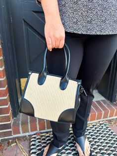 This black and tan handbag is the perfect everyday accessory. This color matches beautifully with the bone color from Oh My Gauze. Natural Color Satchel Shoulder Bag For On-the-go, Trendy Natural Bags With Detachable Strap, Natural Satchel With Detachable Handle, Natural Satchel With Detachable Handle For On-the-go, Chic Handheld Satchel With Braided Handles, On-the-go Natural Satchel With Detachable Handle, Beige Top Handle Satchel For Travel, Casual Cream Top Handle Satchel, Chic Box Bag With Braided Double Handles