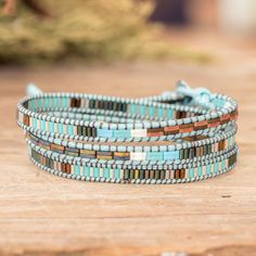 Handcrafted with love and hope, like each wall in the beautiful San Cristobal town, this wrap bracelet by Cristobal Ramirez transports those traditional streets to a heavenly realm. The Guatemalan artisan works with glass beads in sky blue, green and brown hues, all arranged in a captivating brick-inspired pattern. Cheap Blue Wrap Bracelet For Gift, Weaved Bracelets, Heavenly Realm, Handcrafted Beaded Jewelry, Super Duo Beads, Tila Beads, Beaded Leather Bracelet, Duo Beads, Loom Bracelet Patterns