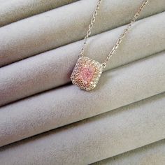 0.50 Carat GIA Light Pink Radiant 0.24 Carats of Surrounding Diamonds 18 Inch Chain Handmade in 18k Pink Diamond Necklace For Gift, Pink Radiant Cut Jewelry For Anniversary, Elegant Pink Radiant Cut Jewelry, Pink Radiant Cut Jewelry With Accent Stones, Pink Pendant Jewelry With Diamond Accents, Elongated Radiant, Radiant Diamond, Double Halo, Pink Diamond