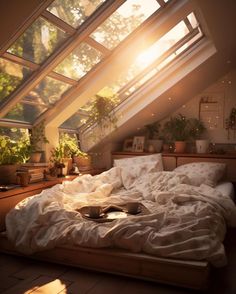 an unmade bed with white sheets and pillows under a slanted roof in a bedroom