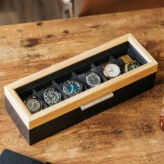 A Modern Take On Watch Storage Introducing the Two-Toned Solid Pine Watch Case by Case Elegance. We have meticulously crafted every detail of this watch box, from the magnets embedded into the solid wood lid, soft plush interior, real tempered glass top, and a bold and modern aluminum lift handle. Store up to six watches with our included ultra-soft watch pillows that compress to fit several different sizes and types of watches. Stop placing your nice watches in the top drawer of your nightstand Watch Cabinet, Luxury Watch Box, Nice Watches, Mens Jewelry Box, Wooden Watch Box, Watch Storage Box, Watch Roll, Watch Holder, Horween Leather