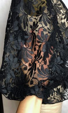 "DETAILS * romantic black lace blouse * puffed half sleeves * rhinestone buttons * elastic waist * completely sheer * perfect for a boudoir photoshoot ERA: 1980s LABEL: n/a SIZE: Medium shoulders: 15\" bust: 36\" (doubled) waist: 26\" sleeve length: 16\" length: 24\" FABRIC: feels like nylon COLOR: black CONDITION: excellent, has been dry cleaned! Please contact us about any questions you may have regarding condition before purchasing. We strive to mention and photograph as many flaws to note ho Black Sheer Lace For Evening, Sheer Black Lace Top For Evening, Black Sheer Lace Top For Evening, Sheer Black Lace For Party, Black Sheer Lace For Party, Black Lace Top For Party With Lace Work, Peach Blouse, Fringe Vest, Black Lace Blouse